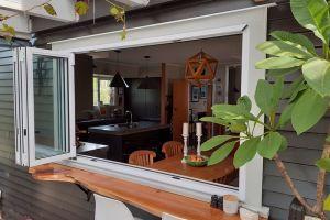 Installation of new double glazed aluminium bi-fold window to outdoor bar area and deck.